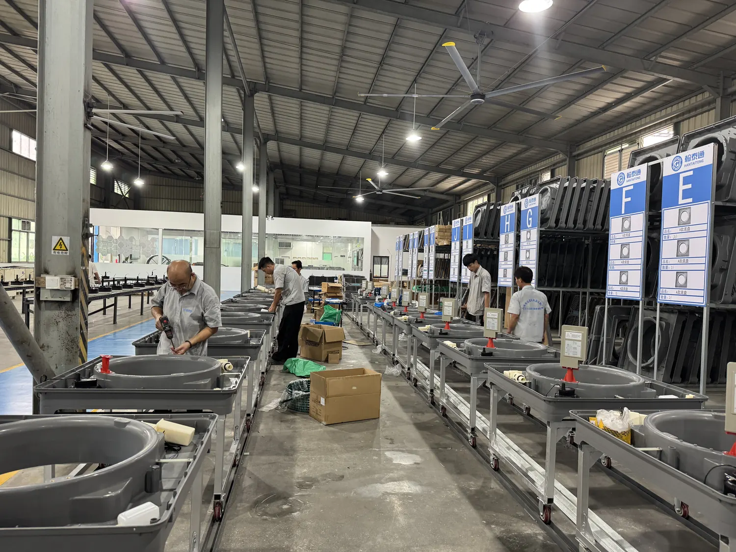 Hantaitong evaporative air cooler body assembly stations with workers