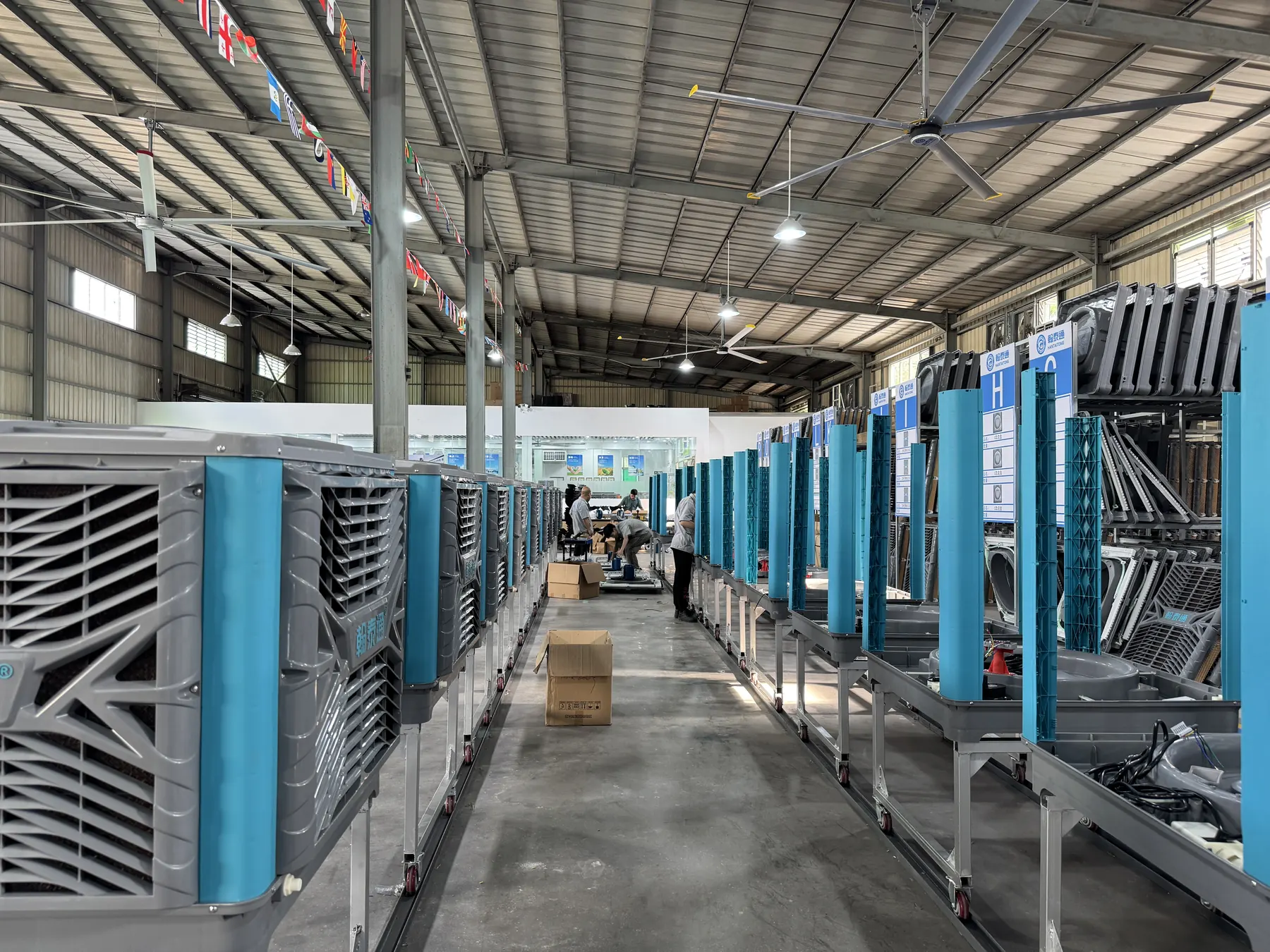 Evaporative air cooler production line with workers and cooling pad frames