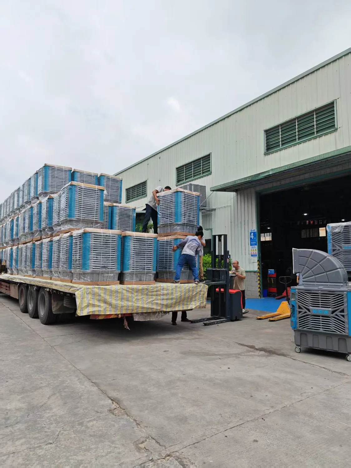 Batch evaporative coolers loaded on truck outside Hantaitong factory