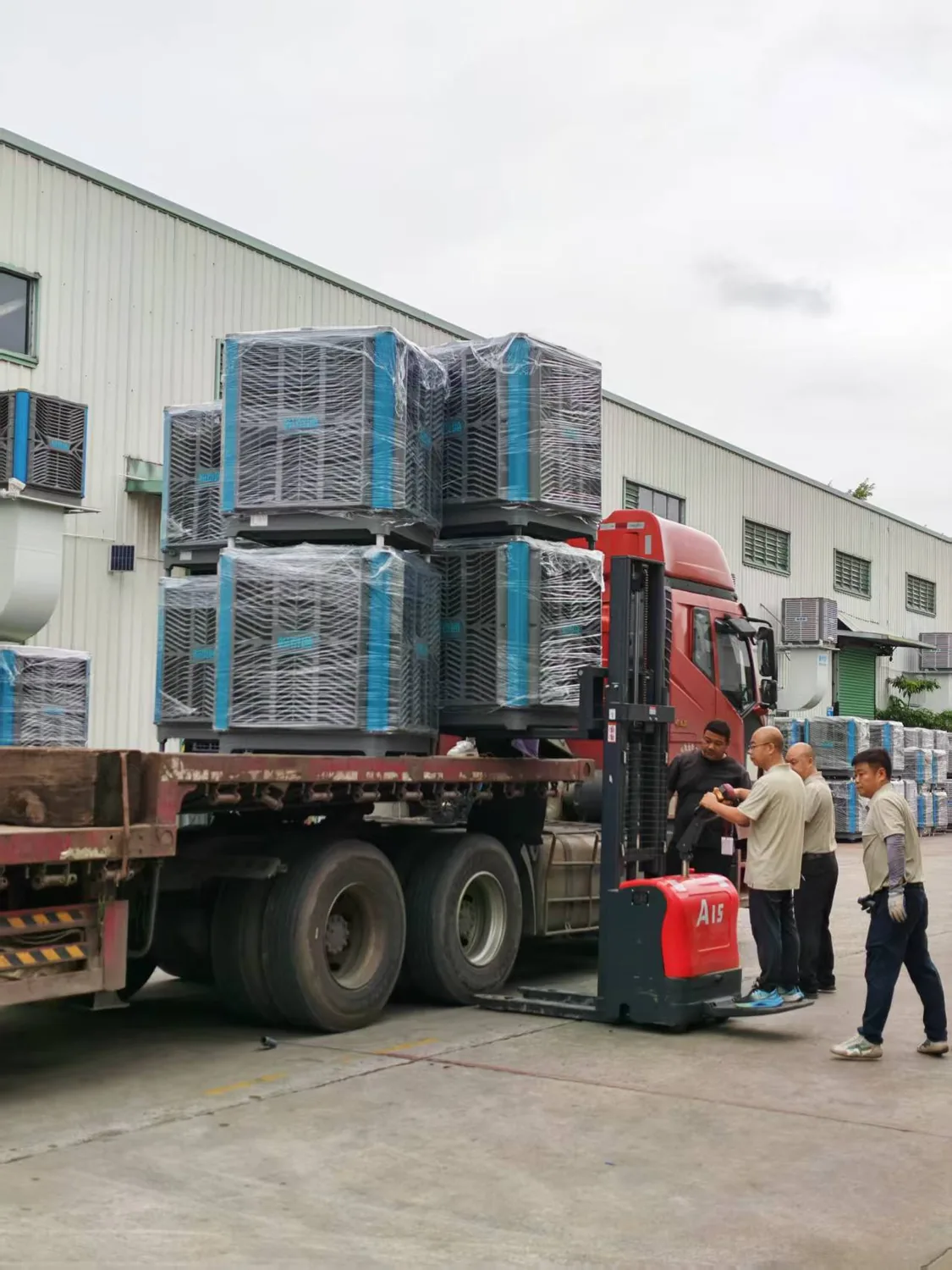 Forklift loading wrapped evaporative coolers for delivery