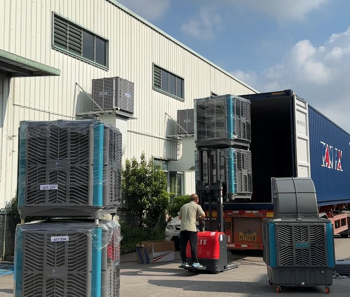 Hantaitong evaporative air coolers being prepared beside an export container