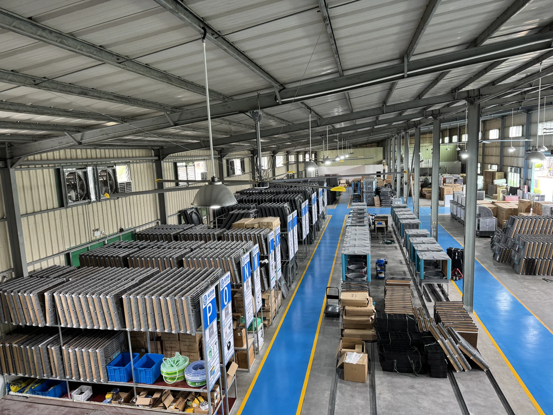 Wide Hantaitong workshop overview with evaporative air cooler parts and organized production lanes